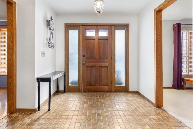 view of carpeted entrance foyer