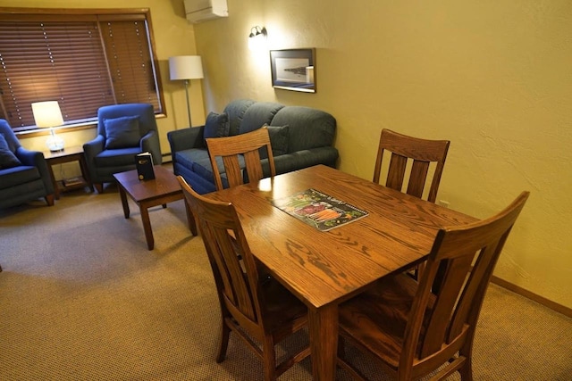 carpeted dining space with an AC wall unit