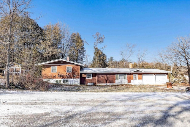 ranch-style house featuring a garage