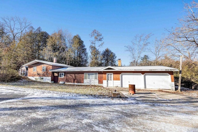 single story home featuring a garage