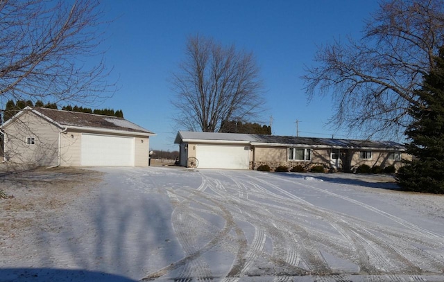 ranch-style home featuring a garage