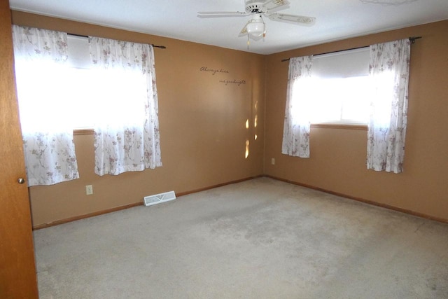 carpeted empty room with ceiling fan