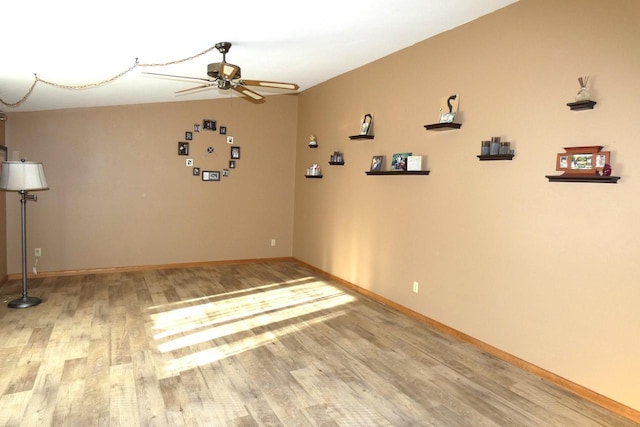 spare room featuring ceiling fan and hardwood / wood-style floors