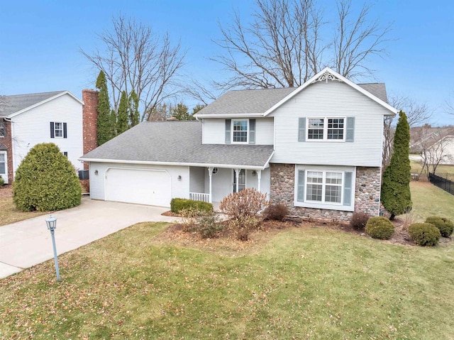 front facade featuring a front yard, a garage, and covered porch