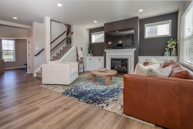 living room featuring a fireplace and wood-type flooring