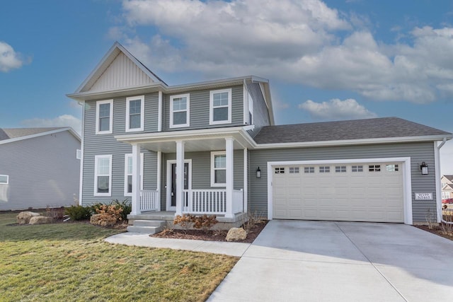 view of front of property with a front yard, a garage, and a porch