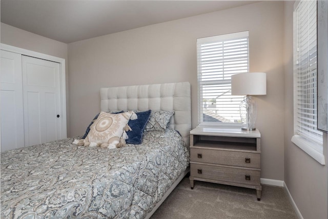 carpeted bedroom with a closet