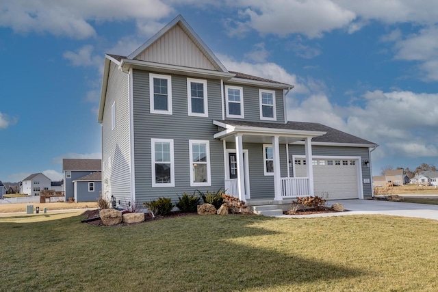 view of front of property featuring a garage and a front lawn