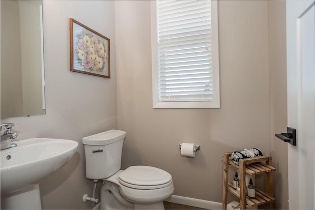 bathroom featuring toilet and sink