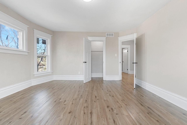 spare room featuring light hardwood / wood-style floors