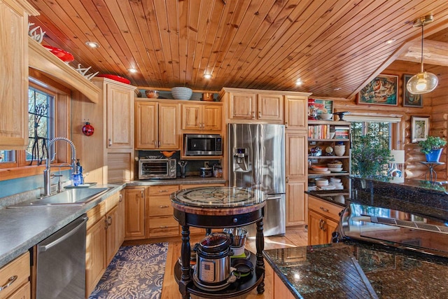 kitchen with wood ceiling, stainless steel appliances, rustic walls, sink, and decorative light fixtures