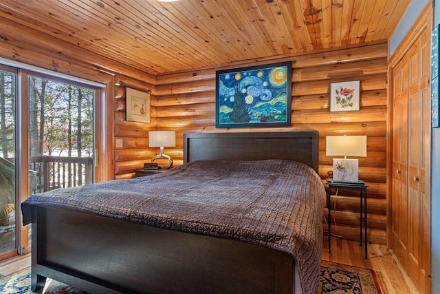 bedroom with rustic walls, access to outside, wood ceiling, and light hardwood / wood-style flooring