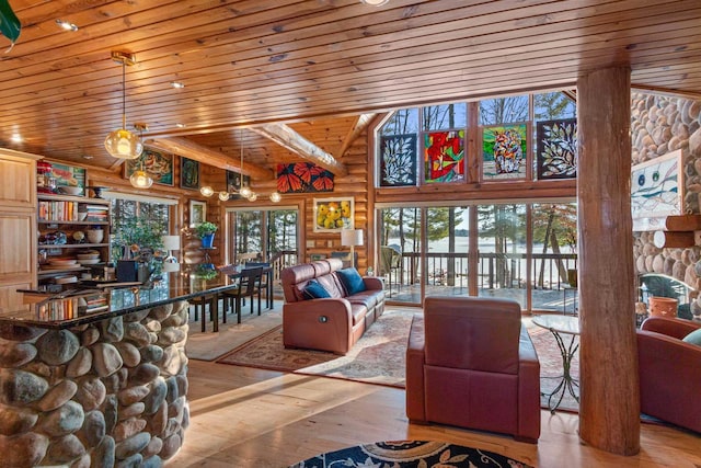 living room with light hardwood / wood-style floors, wooden ceiling, log walls, and beam ceiling