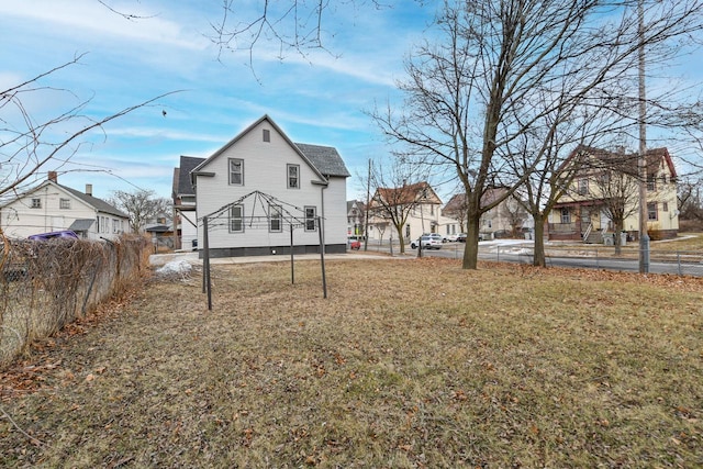 rear view of house with a lawn