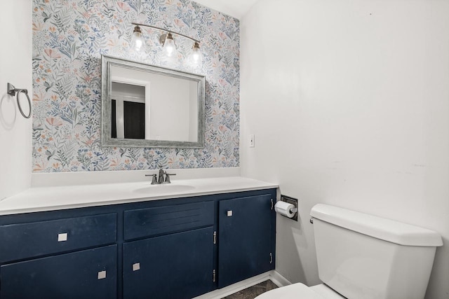 bathroom with vanity and toilet