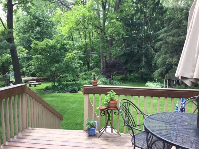 wooden terrace with a lawn