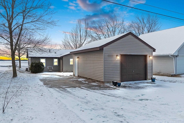 view of snow covered garage