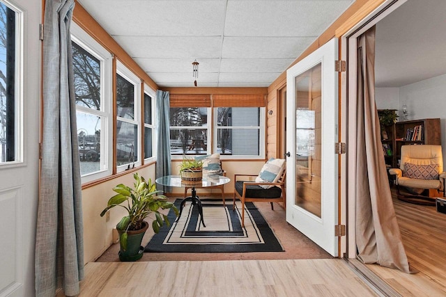 sunroom featuring a paneled ceiling