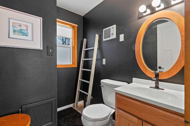 bathroom featuring toilet and vanity