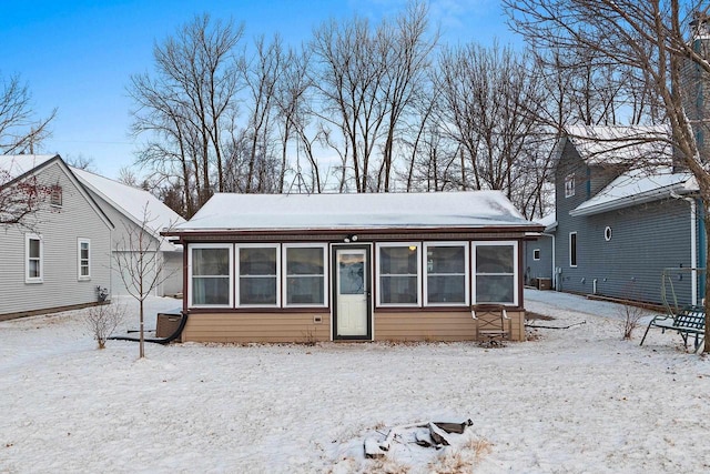 view of front of home with a sunroom