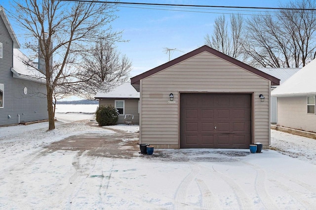 view of snow covered garage