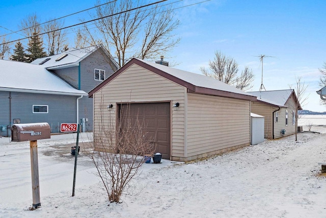 view of snow covered garage