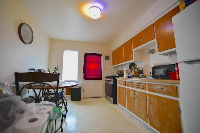 kitchen featuring stainless steel gas range oven