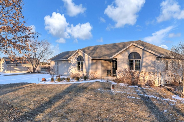 ranch-style home featuring a garage