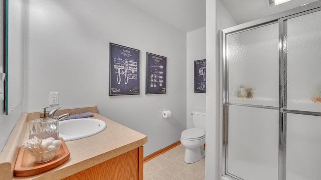 bathroom with toilet, an enclosed shower, and vanity