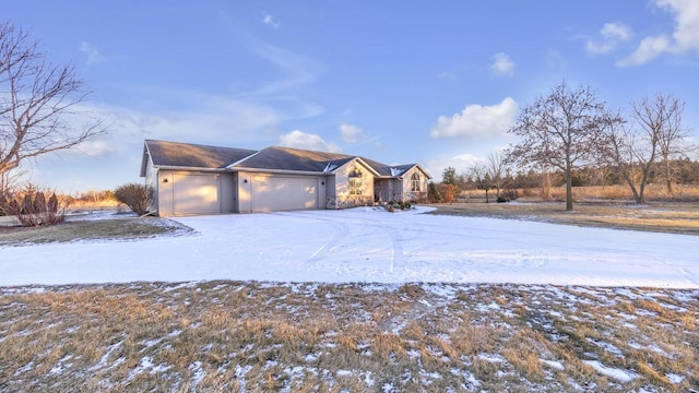 ranch-style home featuring a garage