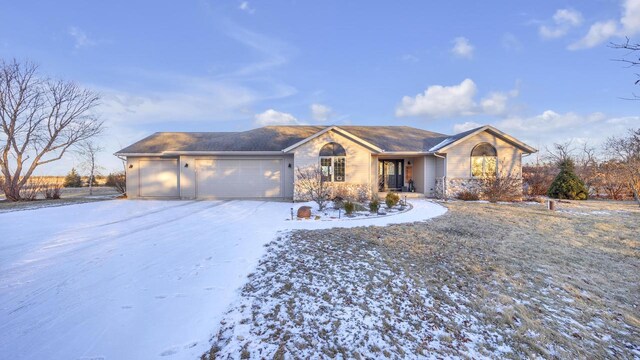 ranch-style home featuring a garage