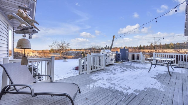 view of snow covered deck