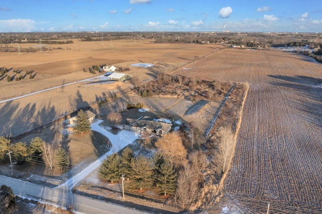 birds eye view of property with a rural view