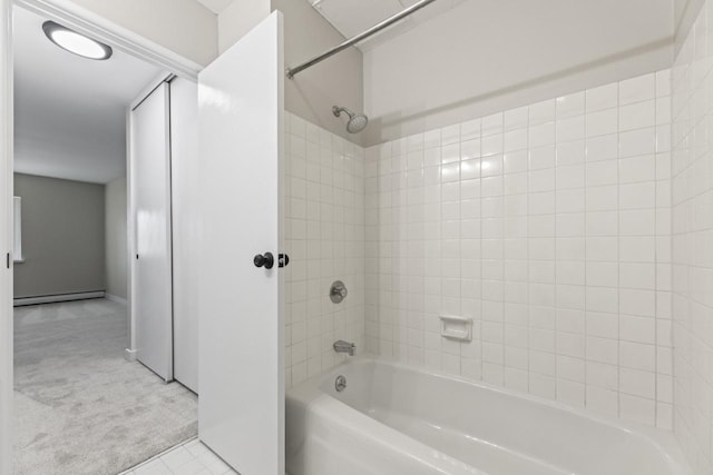 bathroom featuring shower / tub combination and a baseboard heating unit