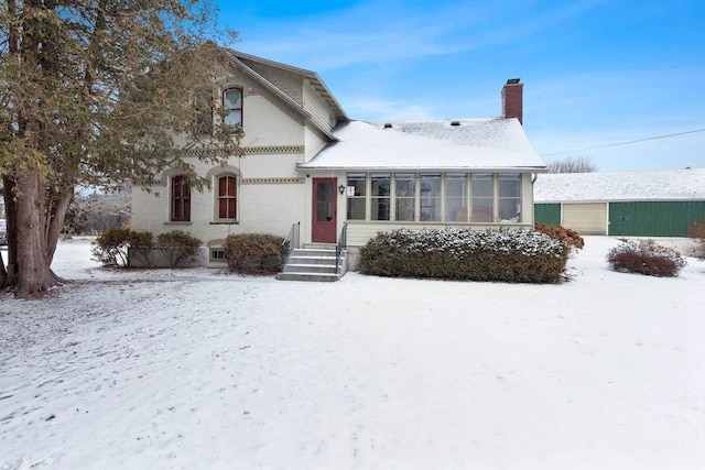 view of front of property with a sunroom