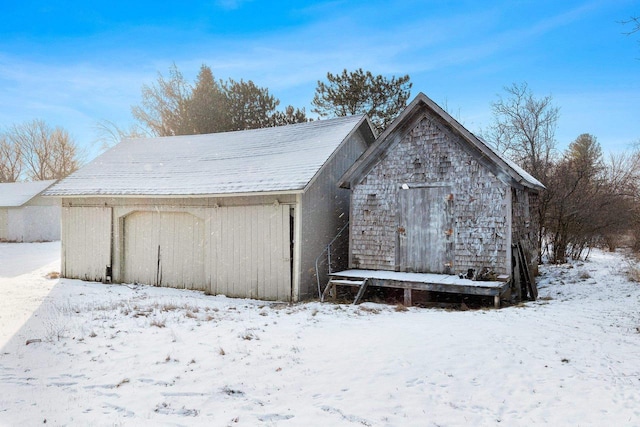 view of snow covered garage