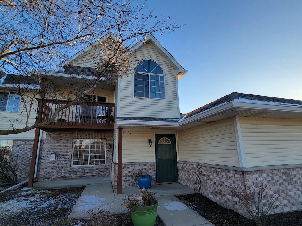 front of property featuring a balcony