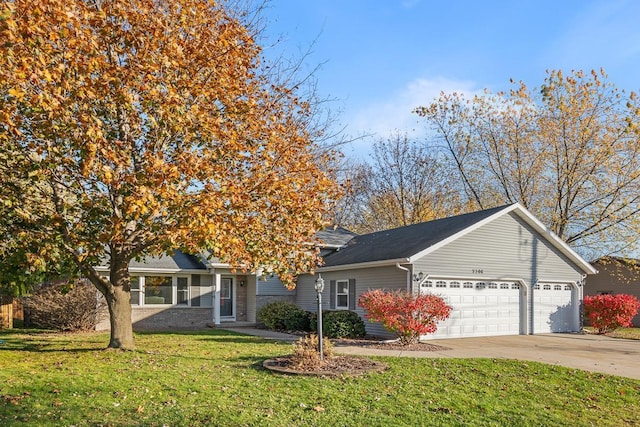 view of front of property with a front lawn and a garage