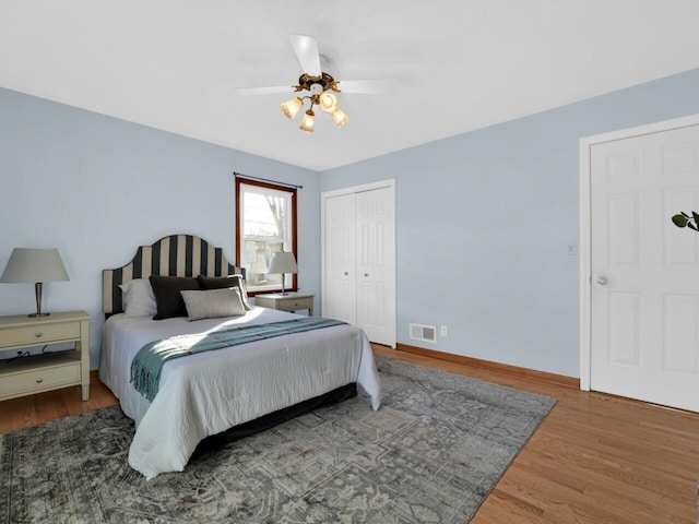 bedroom featuring a closet, ceiling fan, and hardwood / wood-style flooring