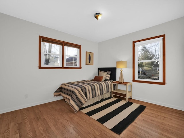 bedroom with hardwood / wood-style flooring