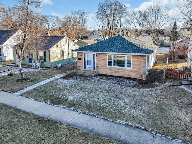 bungalow featuring a front yard