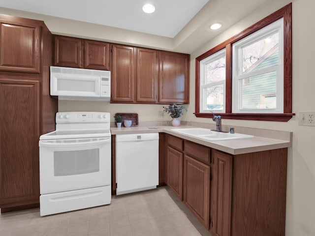 kitchen with white appliances and sink