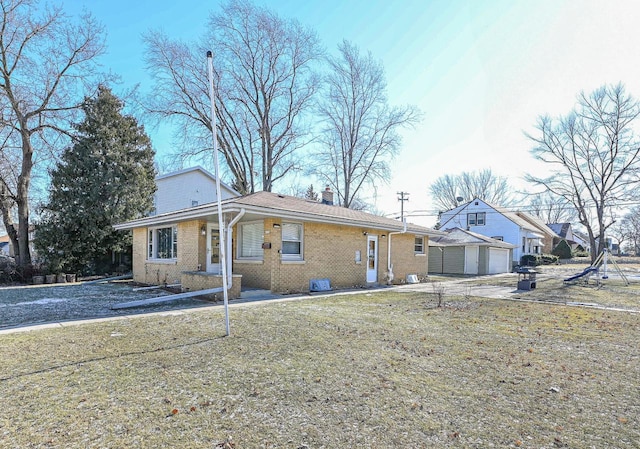 single story home featuring a front yard and a garage