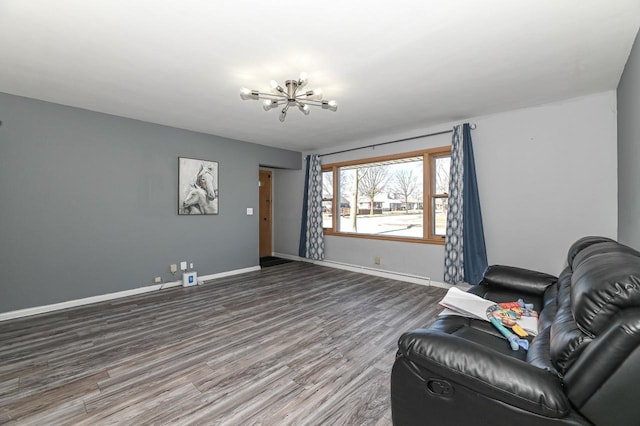 living area with hardwood / wood-style floors and a chandelier