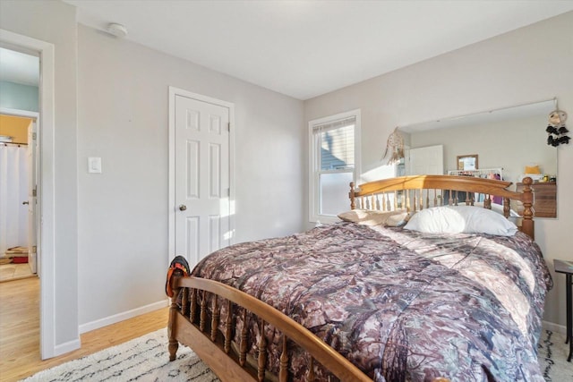 bedroom with light wood-type flooring