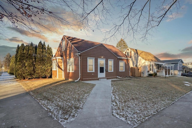 bungalow-style home featuring a yard