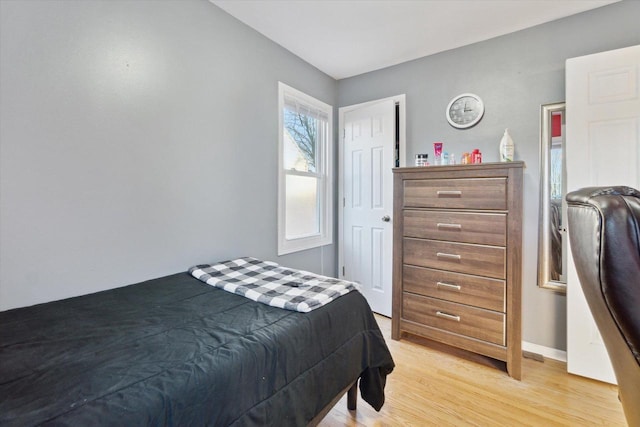 bedroom with light hardwood / wood-style flooring