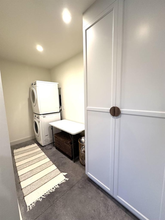 laundry room featuring stacked washer and clothes dryer