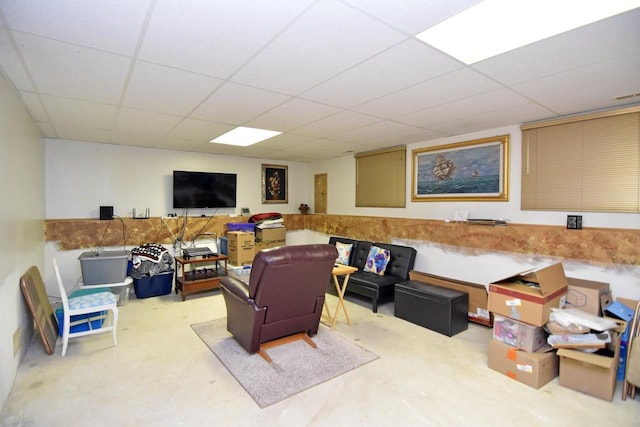 living room featuring a paneled ceiling