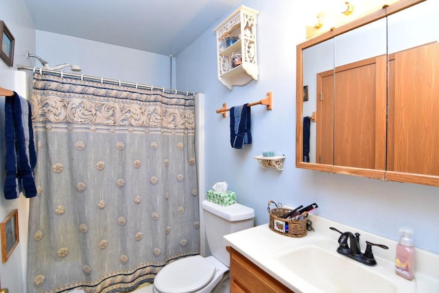 bathroom with a shower with curtain, vanity, and toilet